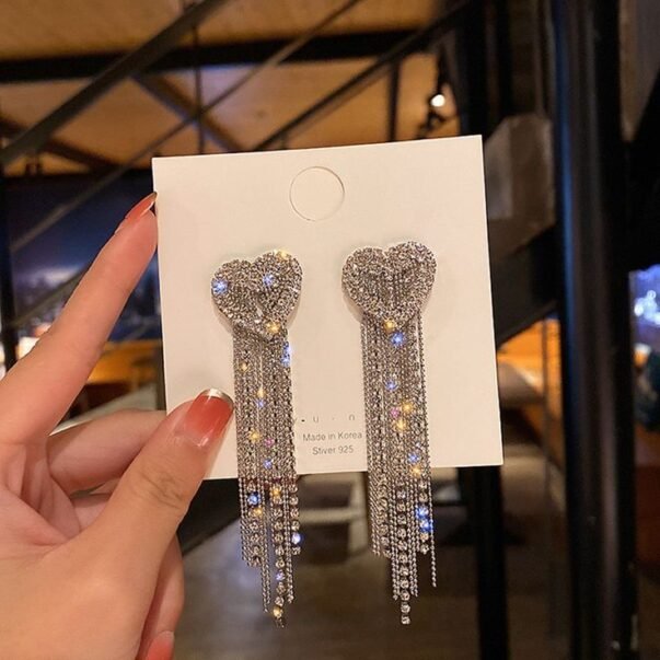 heart shaped diamond embedded earrings with fringes